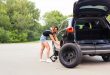 Young woman with a tire breakdown in car