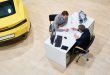 Client Signing Papers to Buy Car