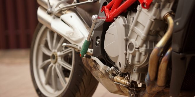 A motorbike standing at the repairing and maintenance service