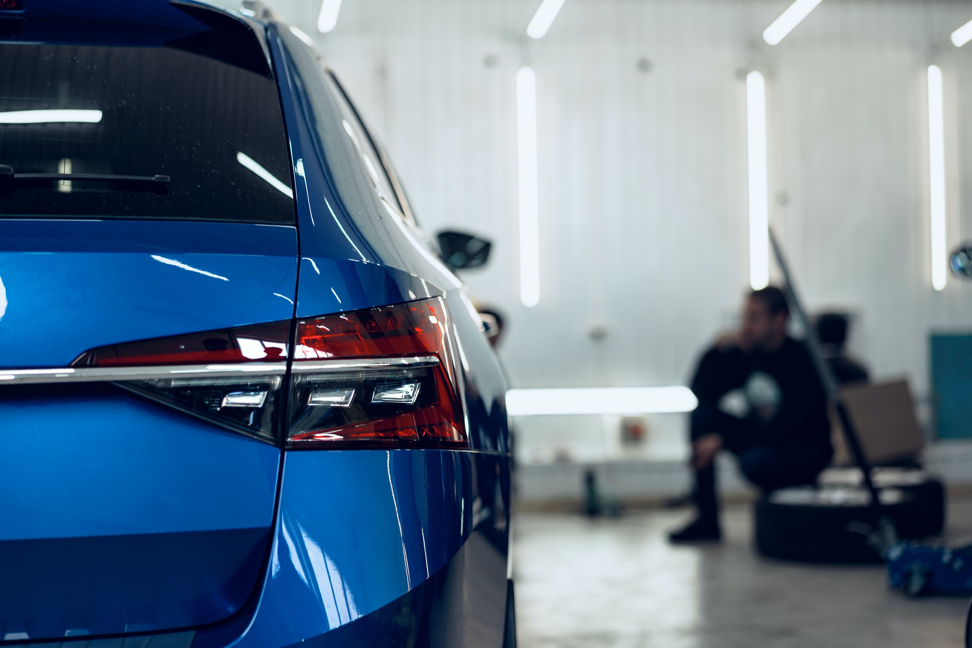 Back light view of new blue car