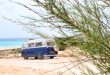 Camper van parked by a beach