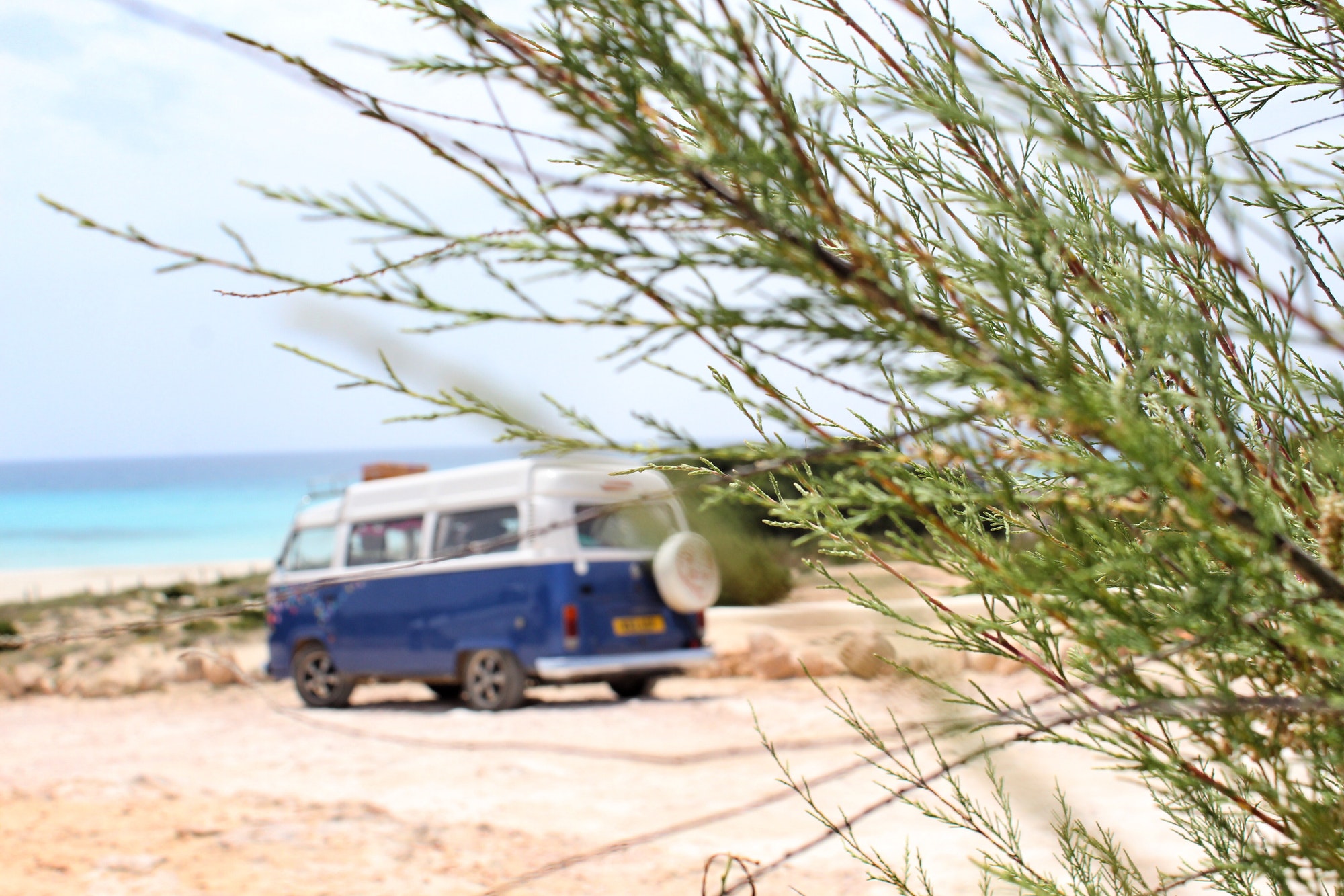 Camper van parked by a beach