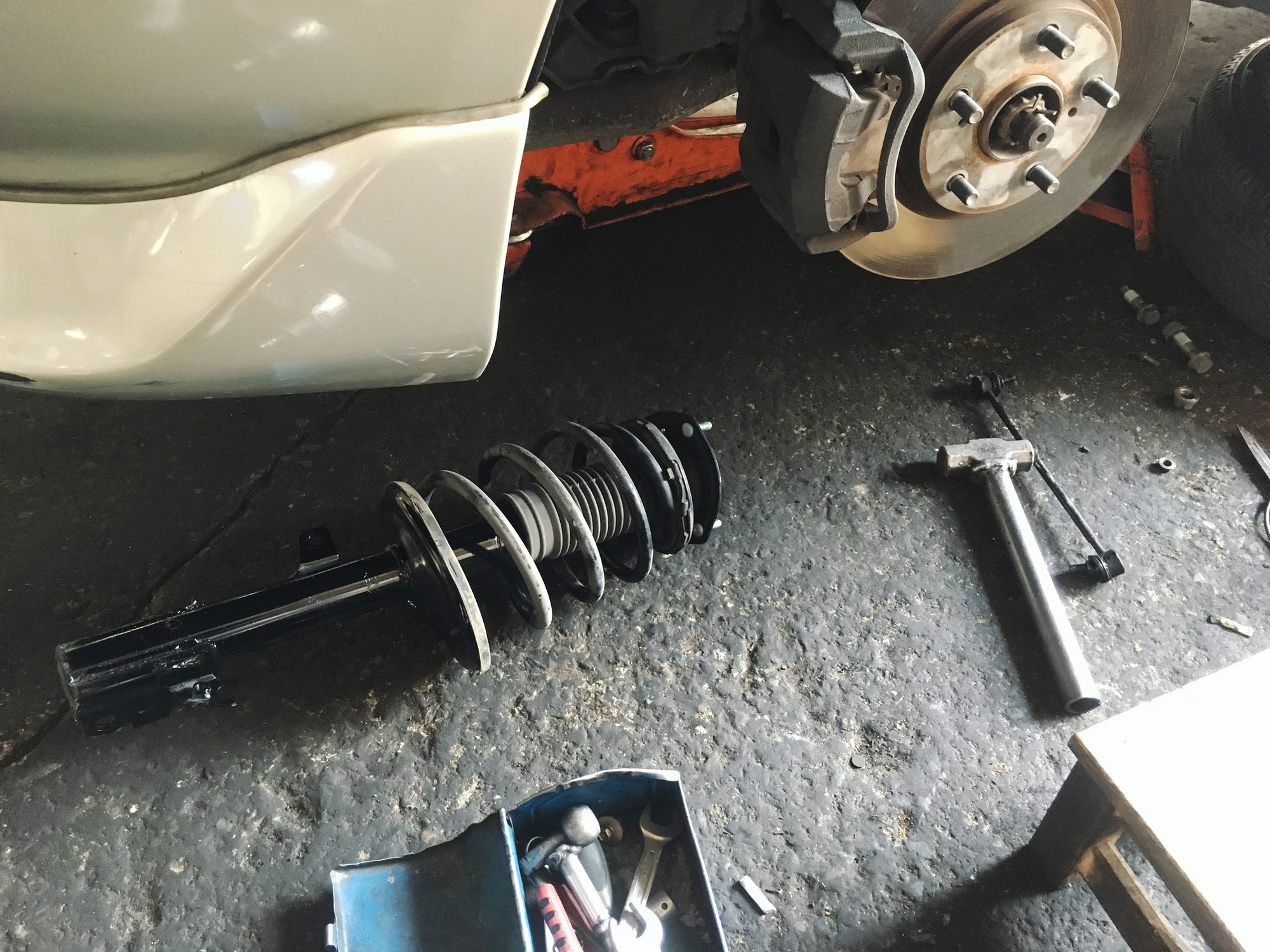 Car suspension, shock absorber and coil spring repair at the garage