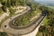 Cars turning left in a sharp curve