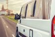 Closeup of camper van traveling to a lighthouse