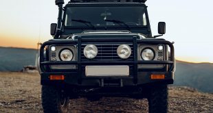 Dark green off-road car in the mountains