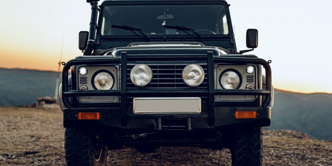 Dark green off-road car in the mountains
