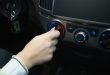 driver turning car air conditioner knob