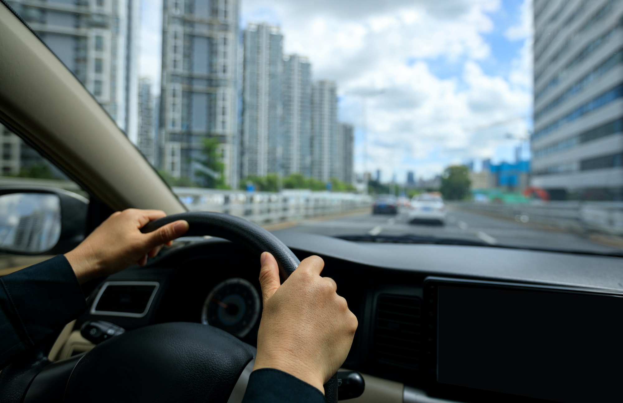 Driving car in modern city