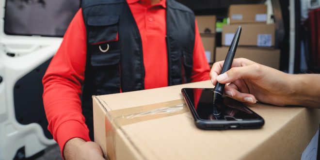 Express courier delivering cardboard box order to customer - Deliver and online buying concept