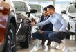 Handsome arab guy customer choosing new sports car
