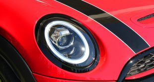 Headlight and grille of the new Mini Cooper automobile