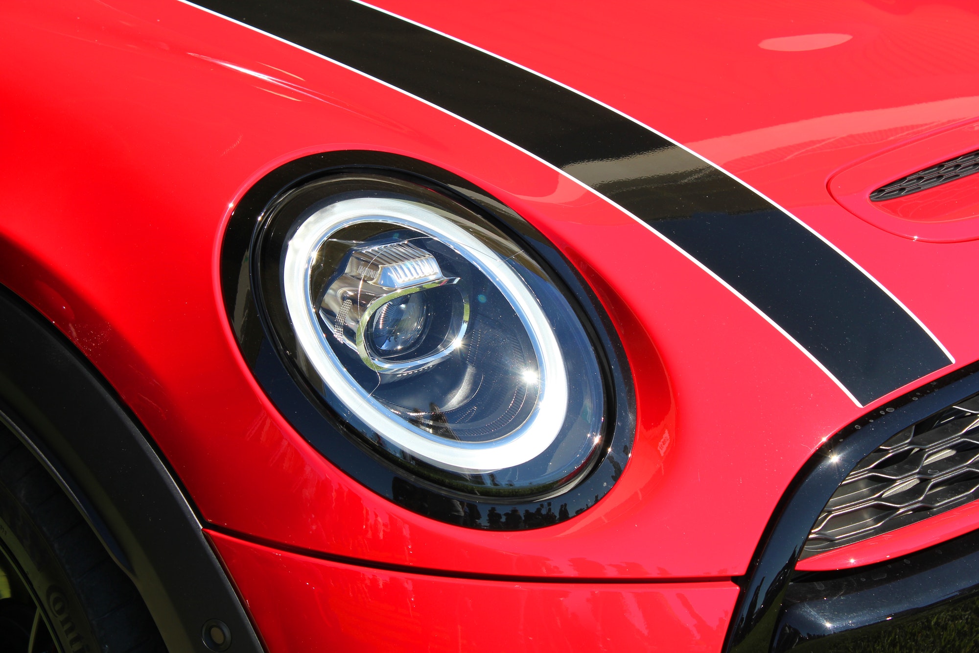 Headlight and grille of the new Mini Cooper automobile