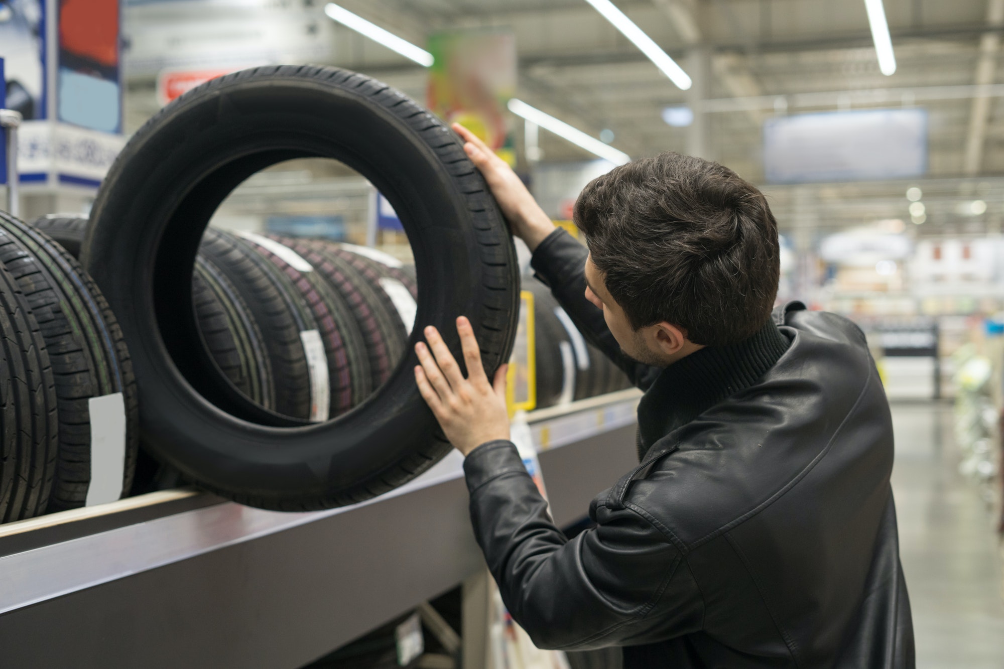 male customer choosing new tires