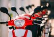 Many Electric Motorbikes, Motorcycles Scooters Parked In Row In