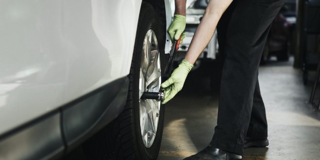 Mechanic fixing the car tires