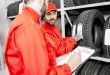 Men working in the warehouse with tires