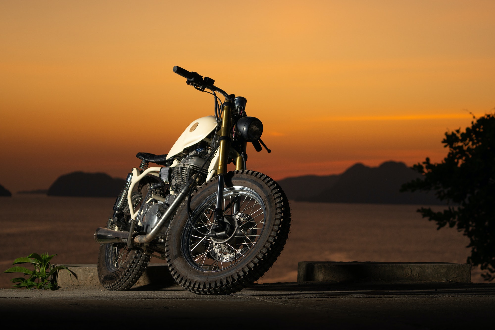 Motorbike near sea during sunset