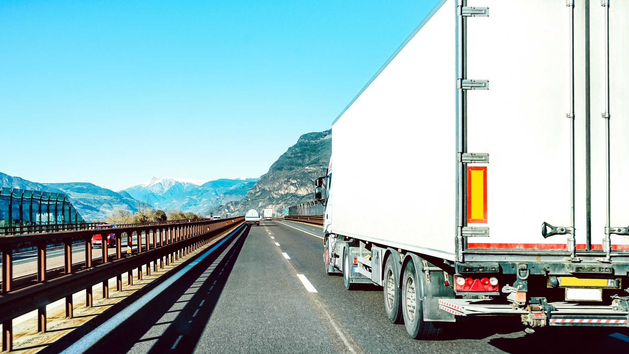 Semi truck speeding on empty highway line