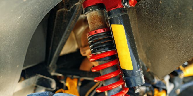 Shock absorber of ATV car close up
