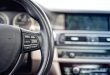 Steering wheel of modern car, details of buttons and adjustment controls