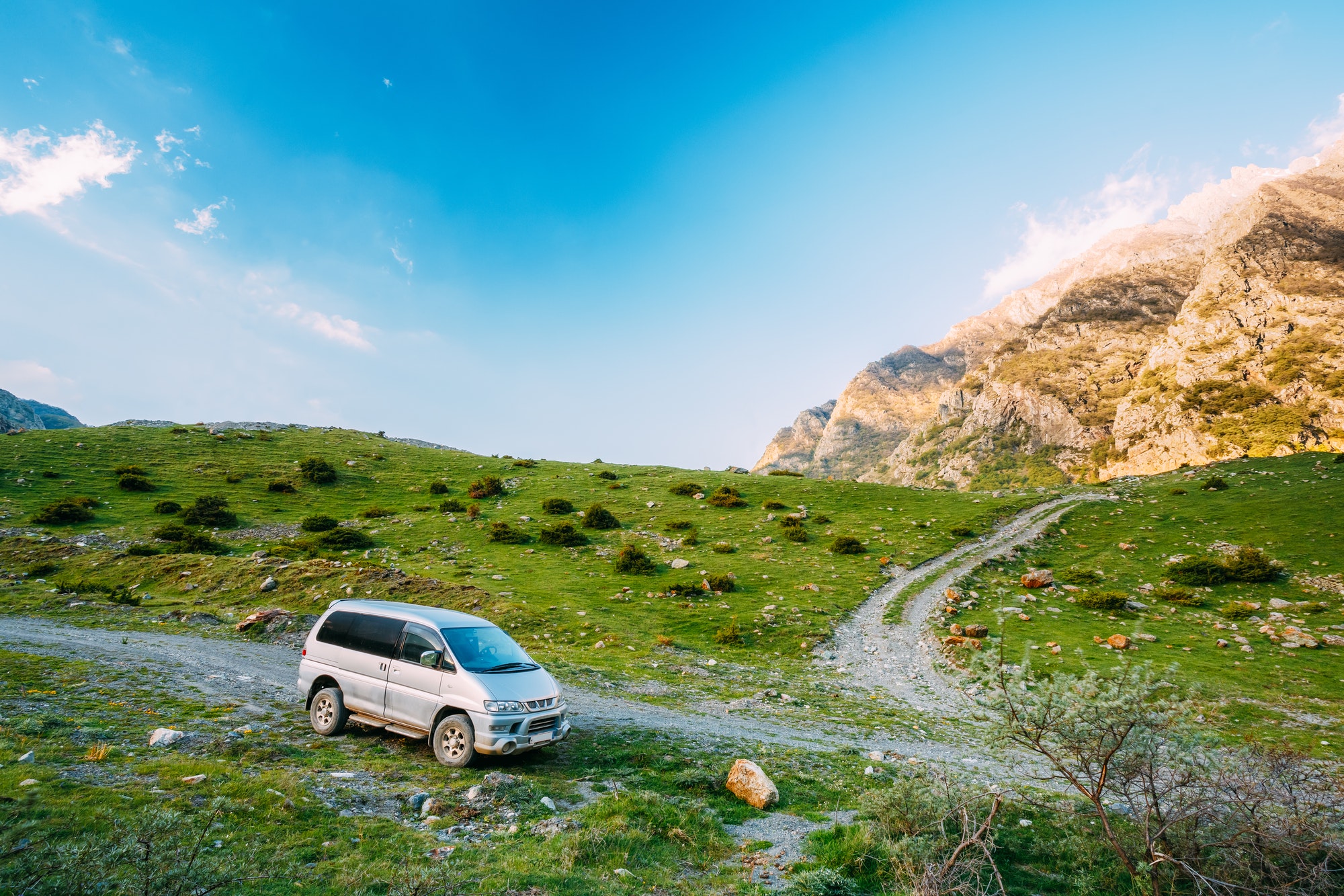 SUV Car On Off Road In Summer Mountains Landscape. Active Lifest