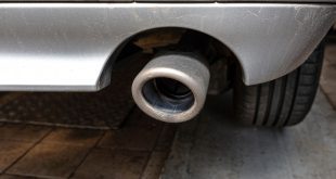The exhaust system in the diesel car seen up close, view from rear of muffler.