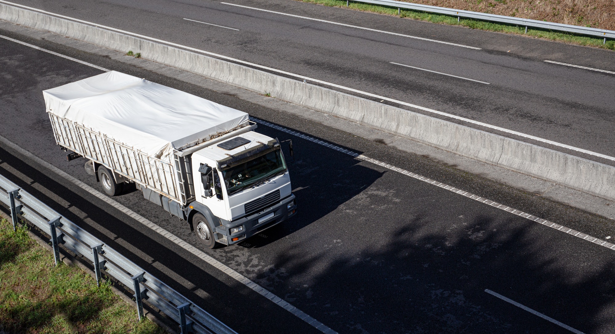 Truck on road with clear container