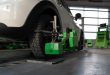 Wheel alignment of car wheels at car repair