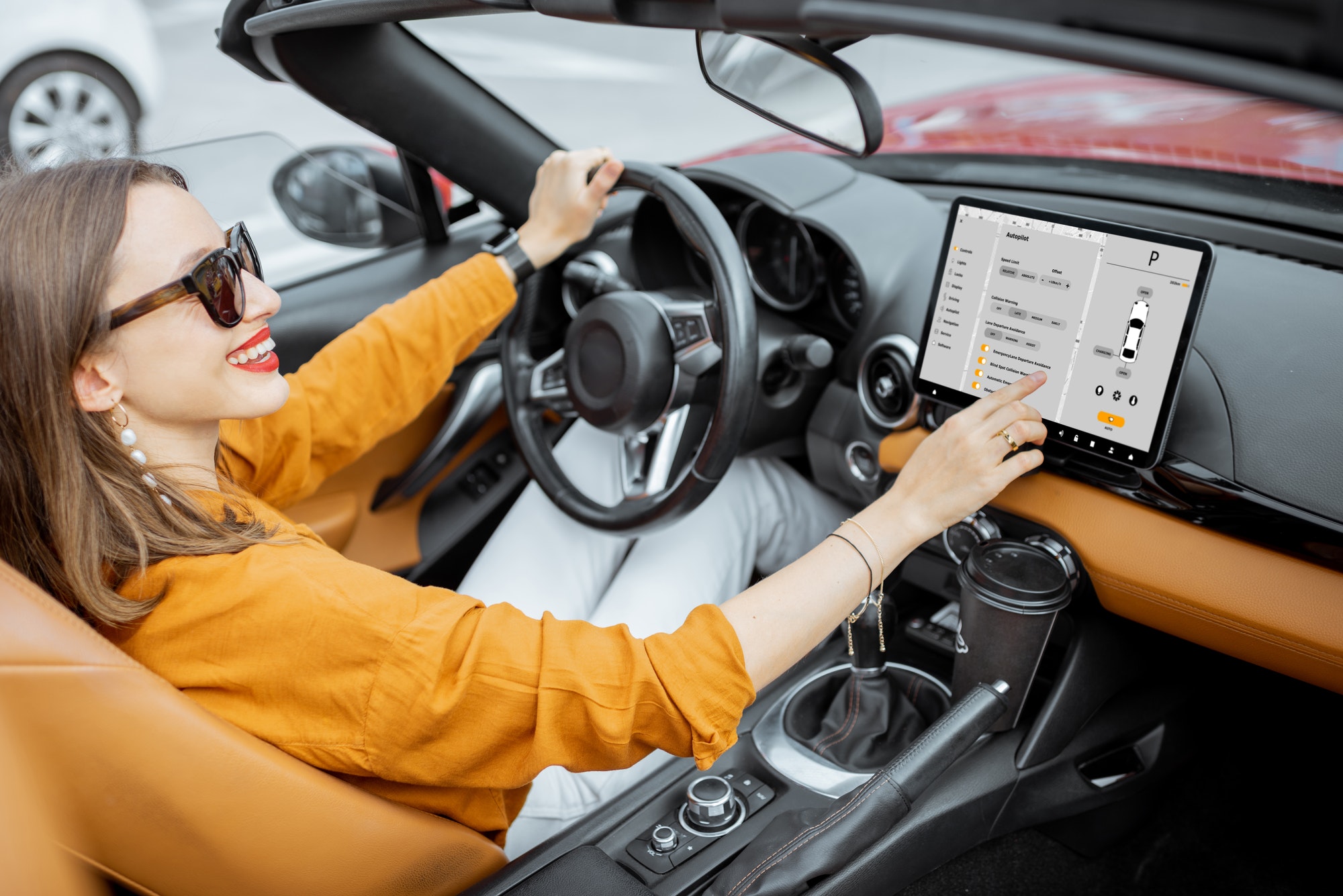 Woman controlling car with a digital dashboard