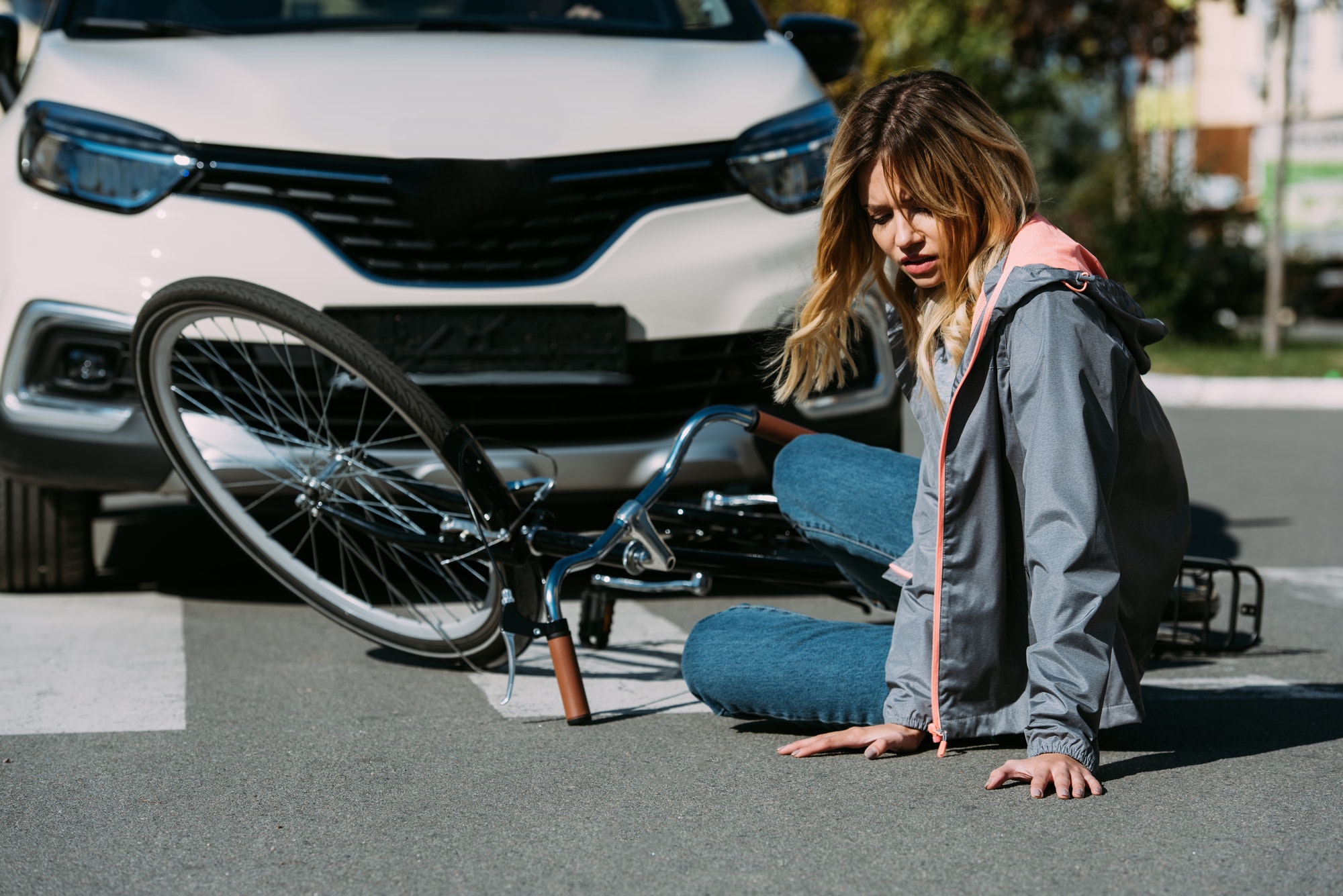 young woman mowed down by car on road, car accident concept