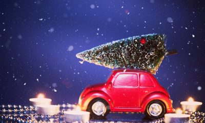 Christmas red car in snowfall