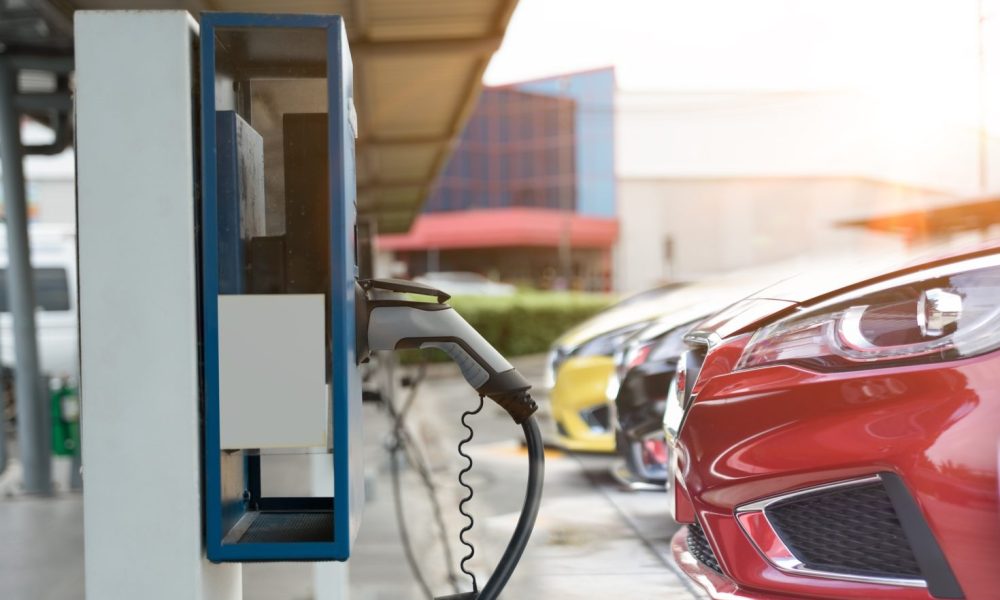Electric car on electric car charging station. Power supply for electric car charging. Clean energy